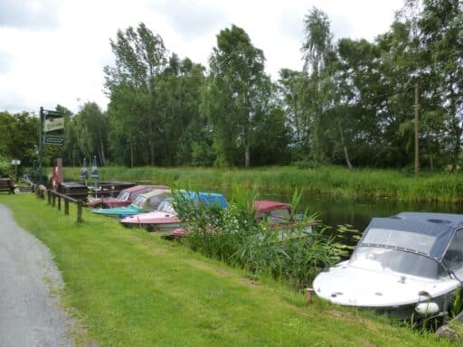 Boats at the landing stage on the canal directly at the campsite