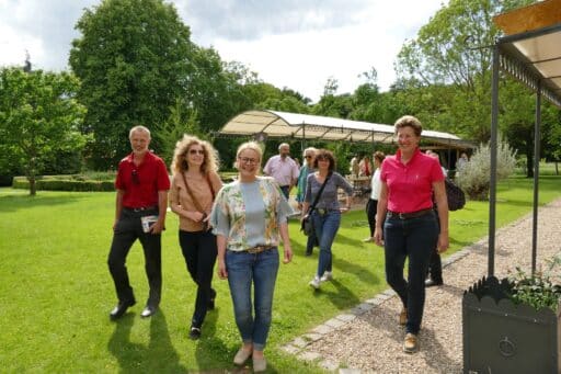 A group is guided through the manor house