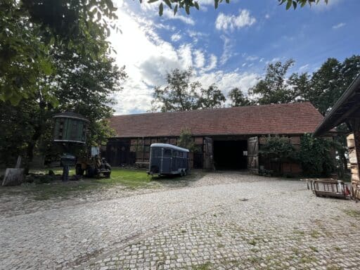 The Nickel farm barn, with a horse trailer in front of it.