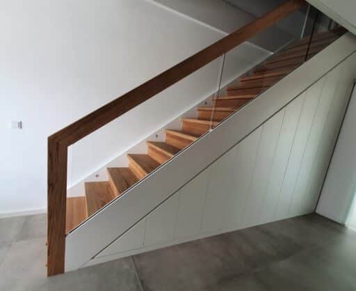 Built-in cupboard under straight staircase